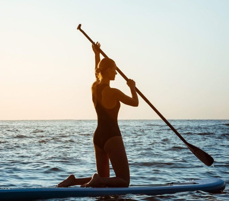 silhouette-young-beautiful-woman-surfing-sea-sunrise (1)